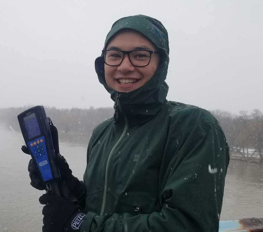 Staff using a water quality sonde to take a spot measurement. Credit: Allison Waedt, Environment and Climate Change Canada