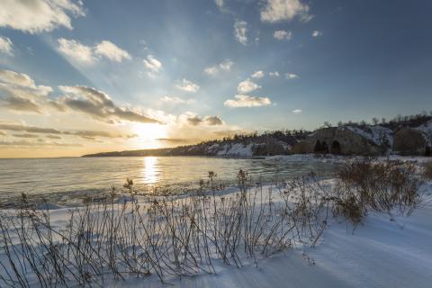 Sunset over bluffs during the winter on Lake Ontario